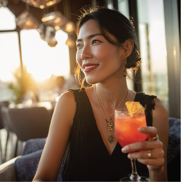 woman drinking an Aperol Seadrift.png__PID:2927164b-b3ff-4f0b-995d-a3c4f6dc3b67